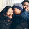Furnace Flue Tips Woman, man. and child in warm winter clothes outside.